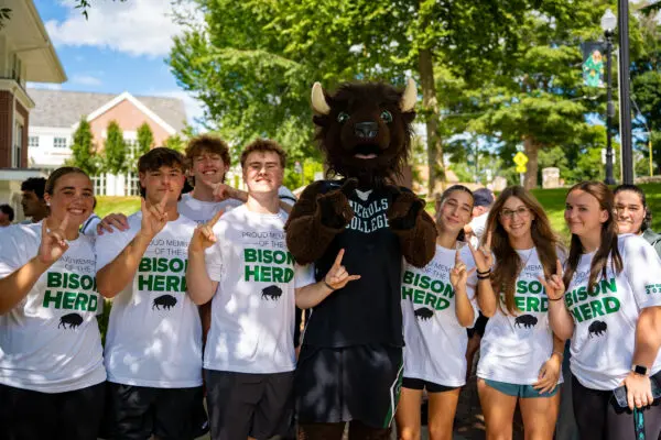 Photo of Thunder with Nichols College first-year students at Convocation.