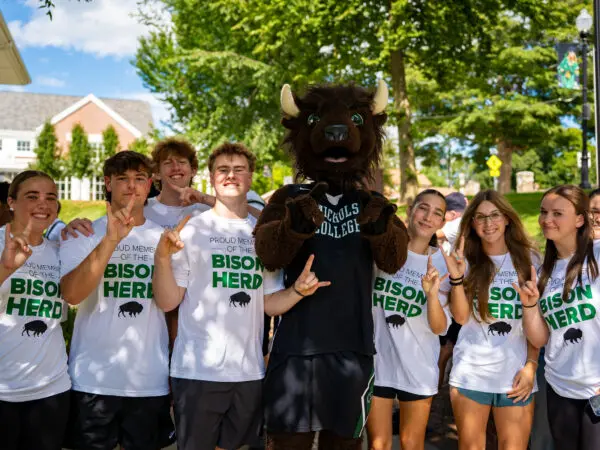 Photo of Thunder with Nichols College first-year students at Convocation.