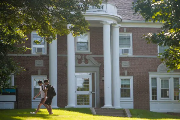 Photo of students walking past Budleigh Hall on campus.