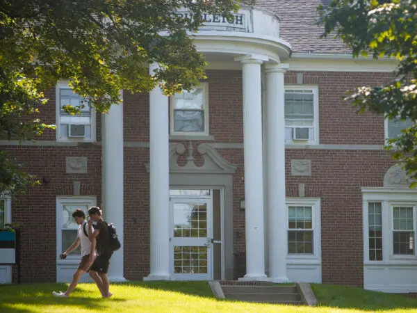 Photo of students walking past Budleigh Hall on campus.