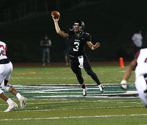 Michael Pina throwing a football in a football game