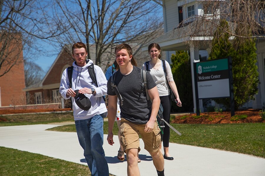 High school students walking across Nichols College's campus