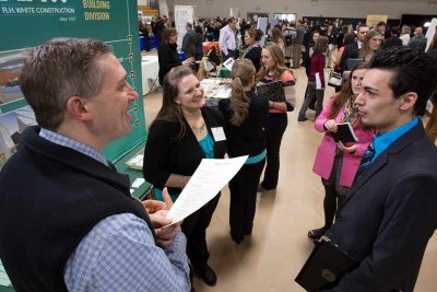 Students talking to recruiters at Nichols College Career and Internship Fair