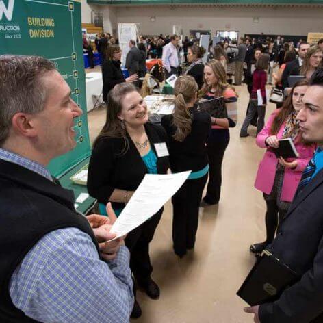 Students talking to recruiters at Nichols College Career and Internship Fair