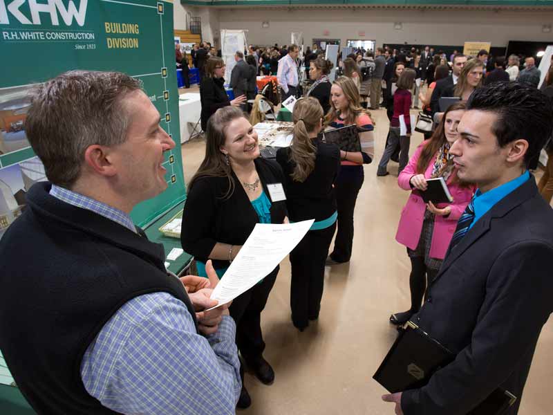 Students talking to recruiters at Nichols College Career and Internship Fair