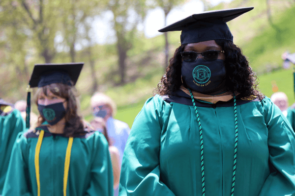 Class of 2021 graduates walking aisle