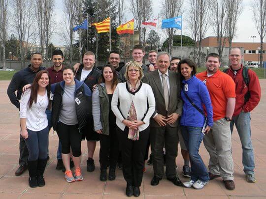 Students by Spanish flags in Spain.