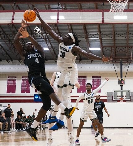 Nichols College men’s basketball player Matthew Alectus taking on Stockton in Pennsylvania on March 11