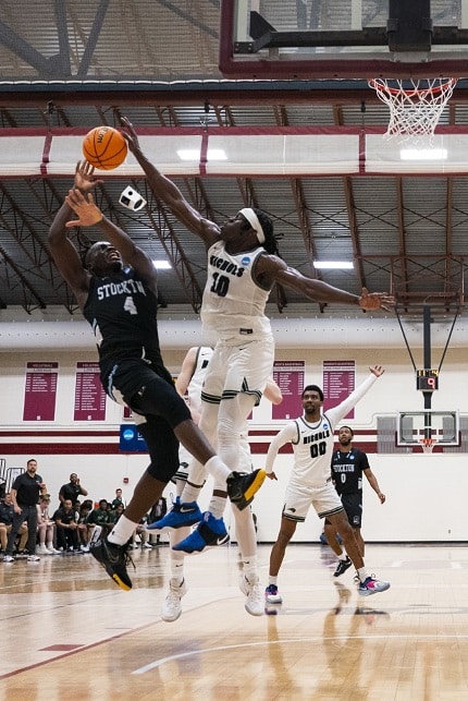 Nichols College men’s basketball player Matthew Alectus taking on Stockton in Pennsylvania on March 11