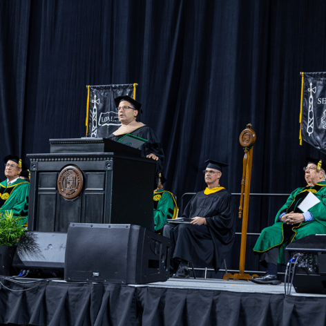 Josh Kraft, owner of New England Patriots Charitable Foundation, speaking at commencement on May 6