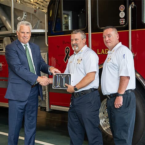 Left to right: Nichols President Bill Pieczynski, Dudley Fire Department Chief Dean Kochanowski and Deputy Chief Erik Spahl