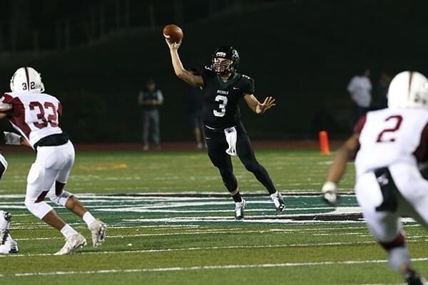 Michael Pina throwing a football in a football game