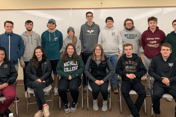 Nichols College students posing in two rows