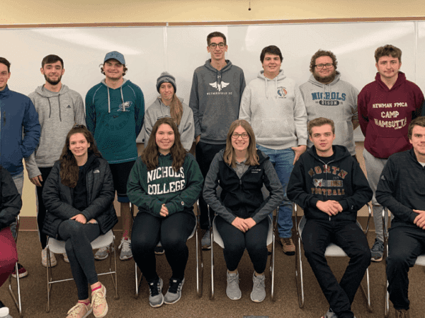 Nichols College students posing in two rows