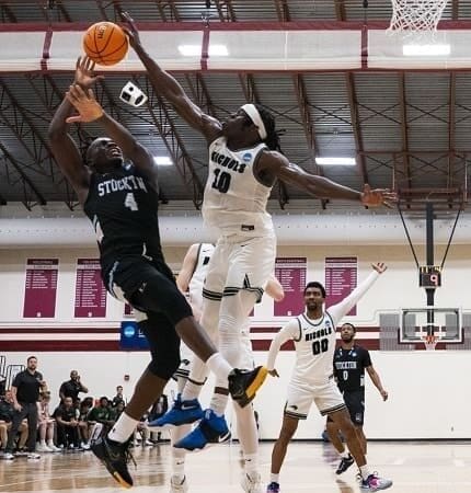 Nichols College men’s basketball player Matthew Alectus taking on Stockton in Pennsylvania on March 11