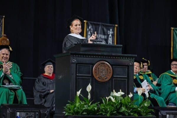 Anne Ackerley delivers the commencement address during the Nichols College 2025 commencement ceremony held on May 3 at the DCU Center in Worcester, Mass
