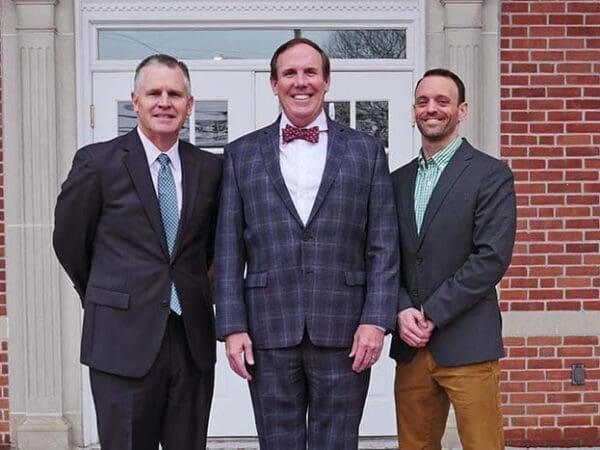 The Nichols College athletic leadership team, from left, Jack Hayes, Glenn Sulmasy, and Eric Gobiel.