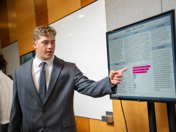 A student presenting at the REAL Symposium.