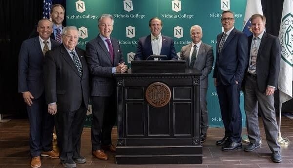 Nichols College Prof. Len Harmon, Prof. Bryant Richards, Former State Sen. and current Nichols College Board of Trustees member Richard T. Moore, Rep. Richard E. Neal, Nichols College President Glenn M. Sulmasy, Provost Daniel Borgia, Prof. Kevin Mentzer and Prof. Mauri Pelto at announcement event on April 7