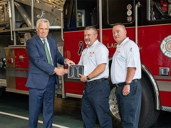 Left to right: Nichols President Bill Pieczynski, Dudley Fire Department Chief Dean Kochanowski and Deputy Chief Erik Spahl