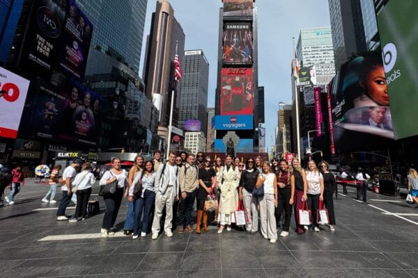 The fashion marketing class poses for a group photo in NYC during their trip to Burlington Stores and Penguin Random House offices on September 30
