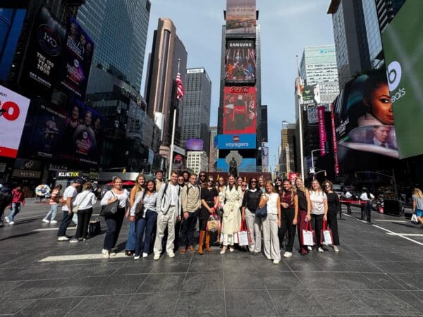The fashion marketing class poses for a group photo in NYC during their trip to Burlington Stores and Penguin Random House offices on September 30