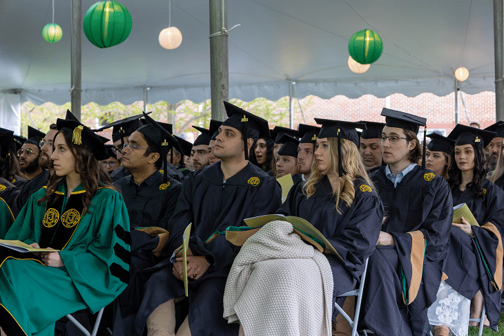 The Graduate School Class of 2023 listen intently to speaker remarks during the ceremony.