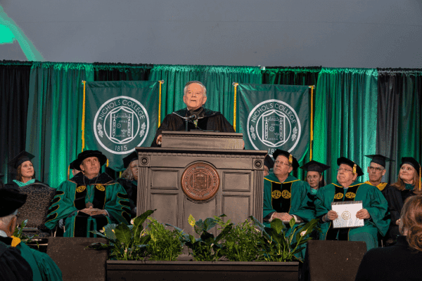 ames Brett delivers keynote remarks during The Graduate School Commencement Ceremony held May 4, 2023 on the Nichols College campus
