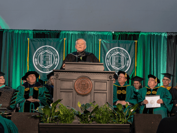 ames Brett delivers keynote remarks during The Graduate School Commencement Ceremony held May 4, 2023 on the Nichols College campus