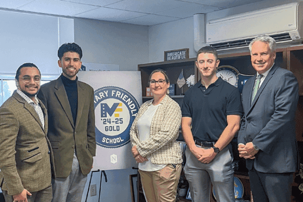 David Sanchez, Ryan Landry, April Girardin ,Compensation and Benefits Manager, Bill Pieczynski, Nichols College President and Jack Merrill pose as Nichols celebrates its Military Friendly status.