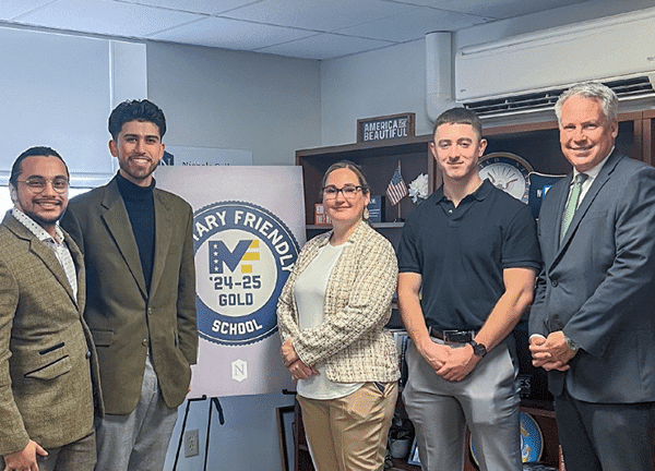 David Sanchez, Ryan Landry, April Girardin ,Compensation and Benefits Manager, Bill Pieczynski, Nichols College President and Jack Merrill pose as Nichols celebrates its Military Friendly status.