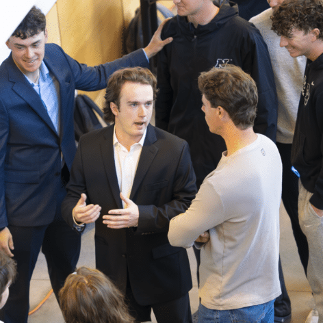 Photo of Ryan Michonski presenting his research project.