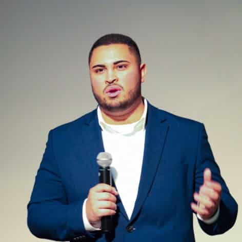 Luis Garcia speaking at the 2026 Annual Elevator Pitch Competition