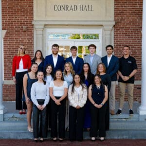 Student government leaders pose atop the steps of historic Conrad Hall.