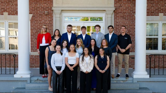 Student government leaders pose atop the steps of historic Conrad Hall.