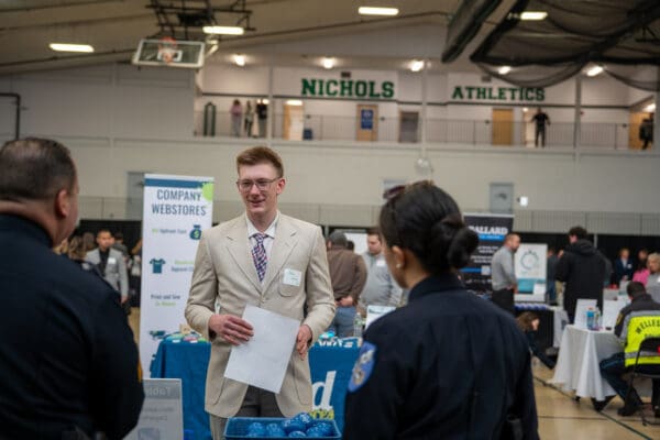 A Nichols College student interacts with a potential employer at the Career and Internship Fair.