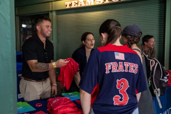 A Nichols College student intern assists with an event at historic Fenway Park in Boston.
