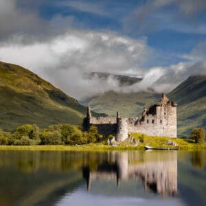 A view of historic Kilchurn Castle in Scotland at sunrise.